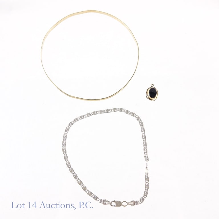 14k Yellow & White Gold Jewelry: 14 karat yellow bold bangle bracelet. Marked 14k and Italy. Approximately 2.75" diameter. Total weight 3.7 grams. ****** 14 karat white gold bracelet. Marked B&M 14K Italy. Weight: 2.8 grams. Approxim