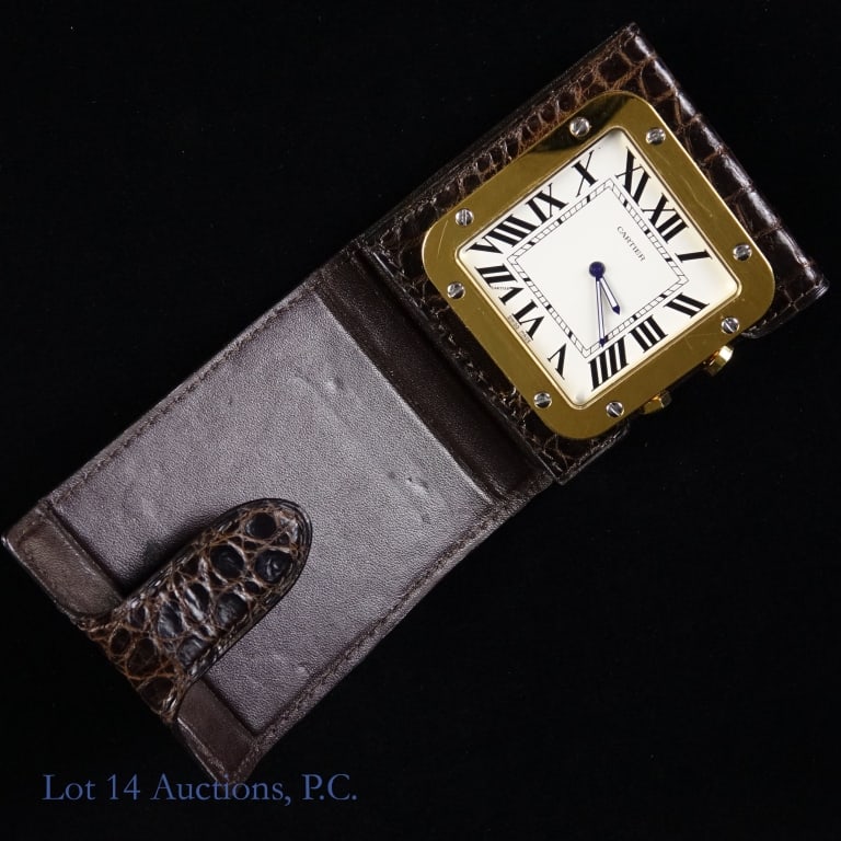 Cartier Travel Alarm Clock Swiss Made **: Swiss Made Cartier Travel Alarm Clock. .5" x 2.5" x 2.75" including case. Model 2750. Clock is Running, ** ALARM FUNCTION NOT OPERATING**. Brown leather case. Light scratches on frame. See photos for
