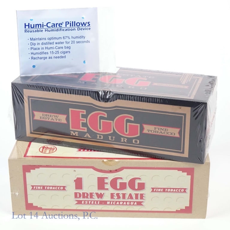 Drew Estate Egg "Larutan" & Maduro Egg "Larutan": 2 cigar boxes included in this lot. 1-Drew Estate Larutan Egg Maduro Cigar, Single, 5.5" x 100, Origin: Nicaragua, Sealed in box. 2-Drew Estate Larutan Egg Natural Cigar, Single, 6" x 42, Origin: Nica