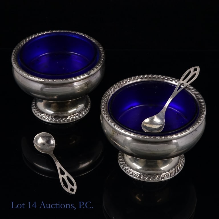 Frank M Whiting Sterling Silver Salt Cellars (2): Pair of silver salt cellars. Bottom marked "Sterling by Frank M. Whiting Company" with "0835" stamped beneath. Includes cobalt blue glass liner and spoons (both marked "sterling"). Total weight of met