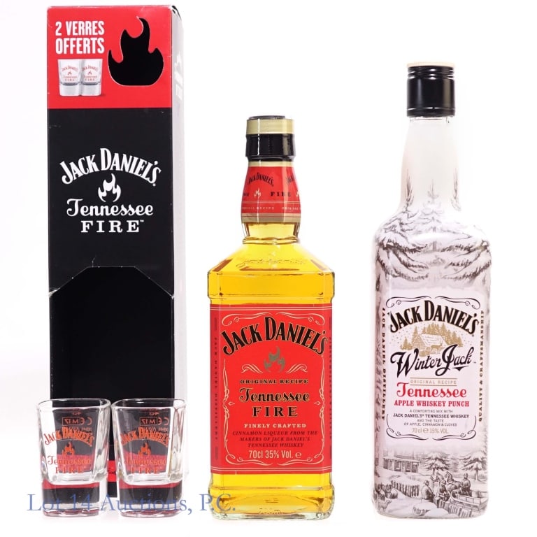 Jack Daniel's Tenn. Fire & Winter Jack Cider (2): This lot contains two Jack Daniel's bottles including: 1-Jack Daniel's Tennessee Fire Cinnamon Liqueur , 70 Proof, 700 ml, French Export. Bottle includes two limited edition Tennessee Fire shot glasse