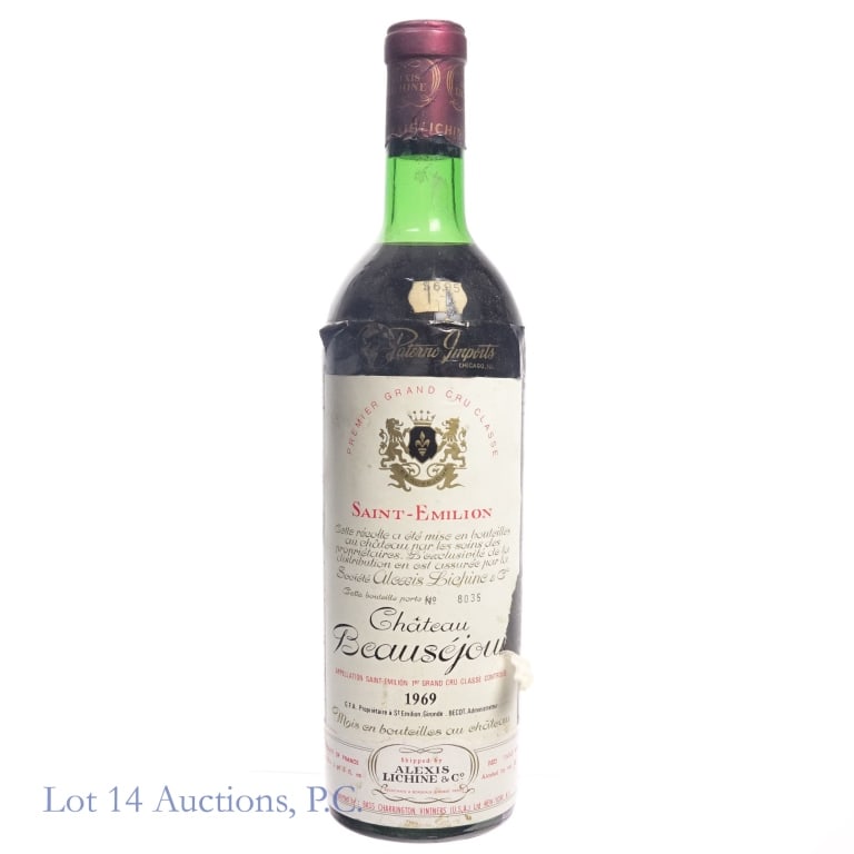 1969 Chateau Beausejour Saint-Emilion Grand Cru: 1969 Chateau Beausejour Saint-Emilion Grand Cru, 12.2% ABV, 1 Pint, 8 Ounces. Vintage: 1969, Region: Bordeaux, France. Bottling #8035, Shipped by Alexis Lichine & Co. Fill at top shoulder.**All vintag
