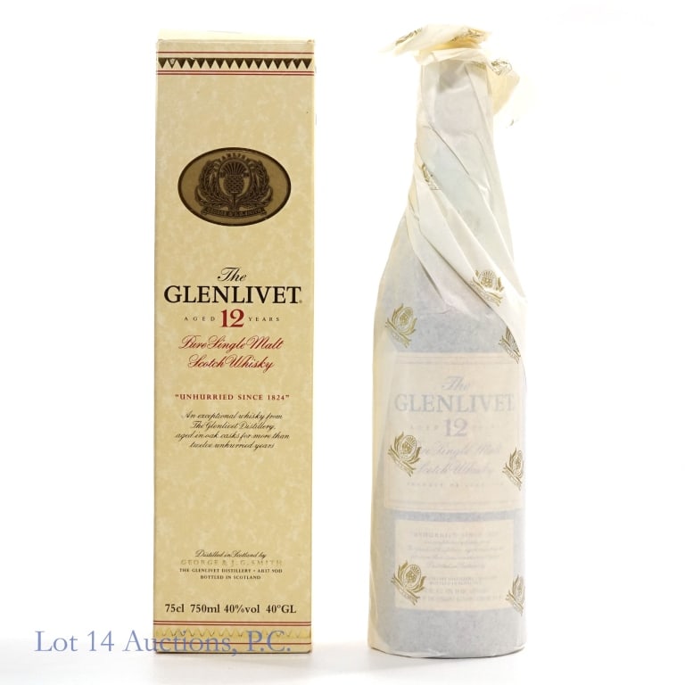 90s Glenlivet 12 Year Pure Single Malt Scotch: Glenlivet 12 Year Pure Single Malt Scotch, 80 Proof, 750 ml, estimated to have been bottled in the 1990s, Distilled by George & J.G. Smith, Original box included, lid slightly worn but intact overall.