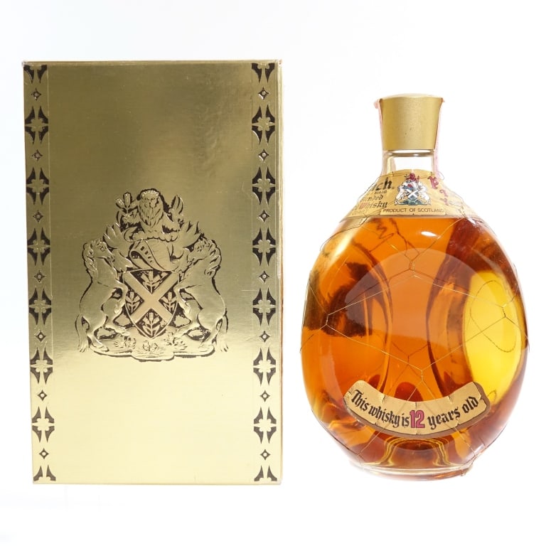 60s/70s Haig & Haig Pinch 12 Year Blended Scotch: Haig & Haig Pinch 12 Year Blended Scotch, 86 Proof, 4/5 Quart, early 1960s-late 1970s bottling. Tax strip in good condition with little to no tearing. Box included.