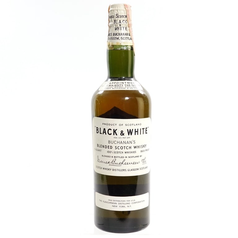 60s/70s Buchanan's Black & White Blended Scotch: Buchanan's Black & White Blended Scotch, 86.8 Proof, 4/5 Quart, early 1960s-late 1970s bottling. Slight scuffs and tears on tax strip but intact and in fair condition overall.