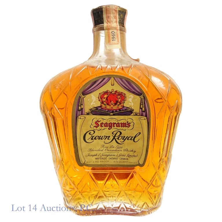 1960 Crown Royal Fine De Luxe Candian Whisky: Crown Royal Fine De Luxe Candian Whisky, 80 Proof, 4/5 Quart, Distilled: 1960. Tax strip worn and stained but intact overall. Box and bag NOT included, discoloration or moisture damage to front of box