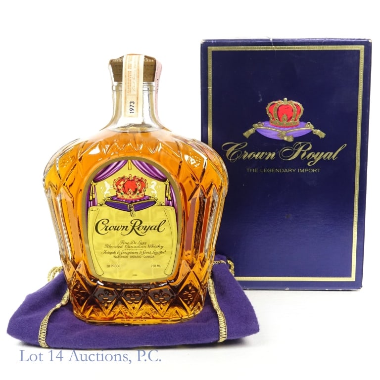 1973 Crown Royal Fine De Luxe Canadian Whisky: Crown Royal Fine De Luxe Blended Canadian Whisky, 80 Proof, 750 ml, Distilled: 1973. Tax strip in good condition with little to no tears. Original box and bag included.