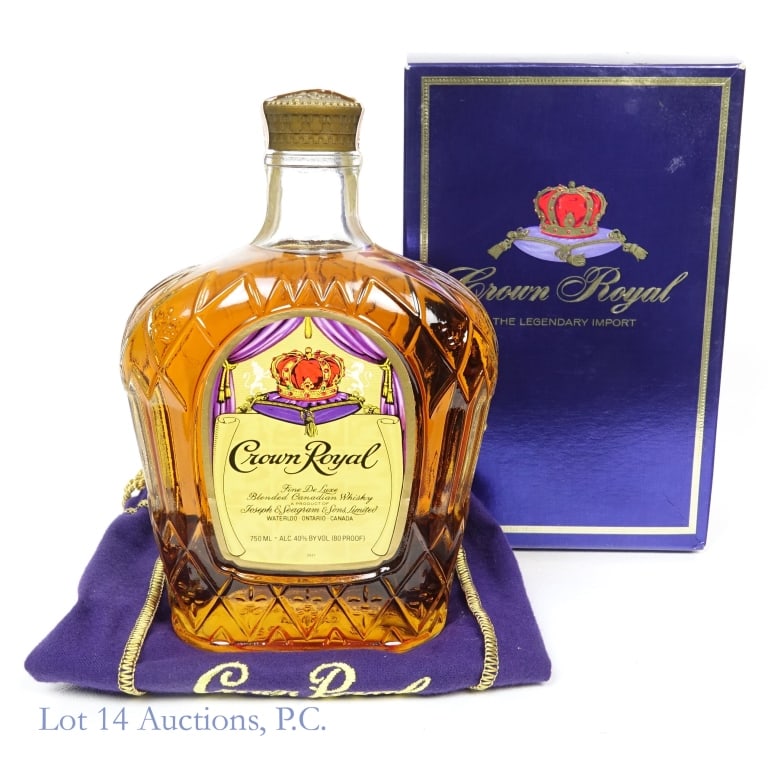 1977 Crown Royal Fine De Luxe Canadian Whisky: Crown Royal Fine De Luxe Blended Canadian Whisky, 80 Proof, 750 ml. Distilled: 1977. Tax strip in good condition with only minor tears. Box and bag included.