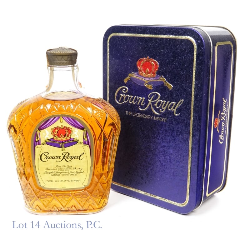 1981 Crown Royal Fine De Luxe Canadian Whisky: Crown Royal Fine De Luxe Blended Canadian Whisky, 80 Proof, 750 ml, Distilled: 1981. Tax strip in fair condition with only minor bending and scuffs. Tin box included.