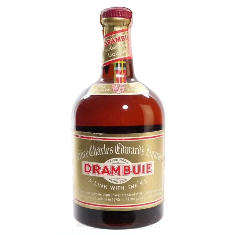 60s/70s Drambuie Liqueur (1 L): Drambuie Prince Charles Edward's Liqueur, 80 Proof, 1 Liter, early 1960s-late 1970s bottling. Tax strip torn in multiple places but intact overall.