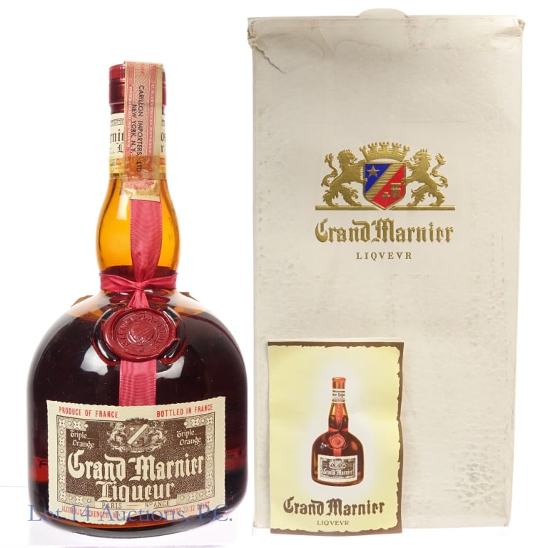 60s/70s Grand Marnier Liqueur: Grand Marnier Liqueur, 80 Proof, 23/32 Quart, early 1960s-late 1970s. Tear on bottom front label, tax strip also torn but intact overall. Box included.