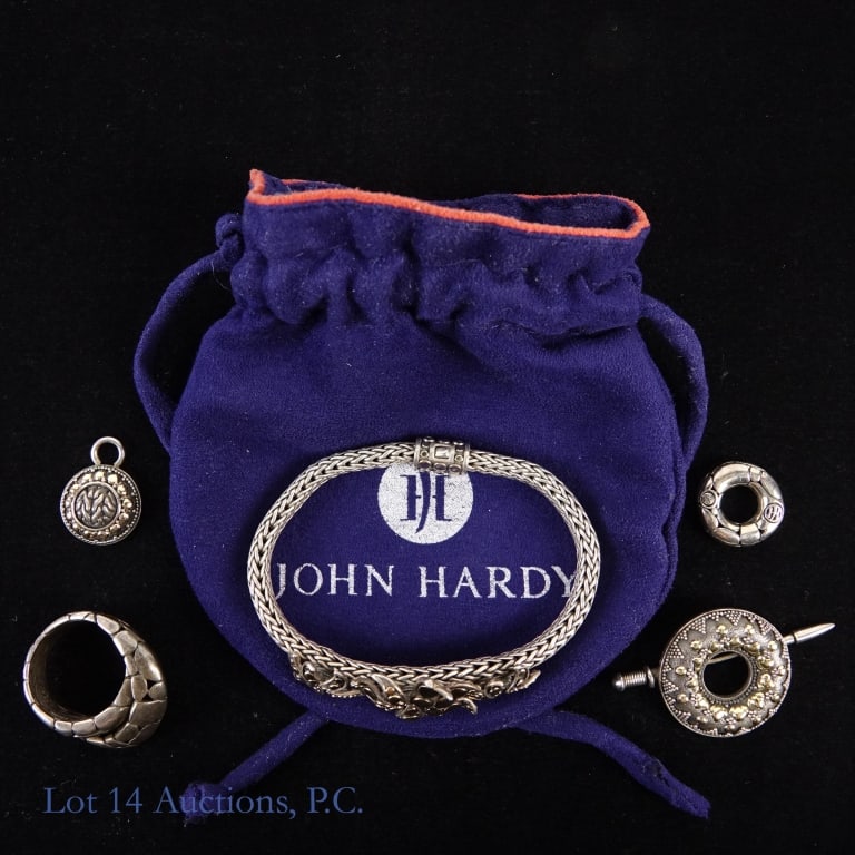 John Hardy 18K Sterling Silver Jewelry (5): John Hardy 18K Sterling Silver Jewelry. All items marked "18K" and "925". 3 charms (?), bracelet, and ring. Ring size 8.5. Total weight: 67.4 grams. Also includes navy blue John Hardy pouch.