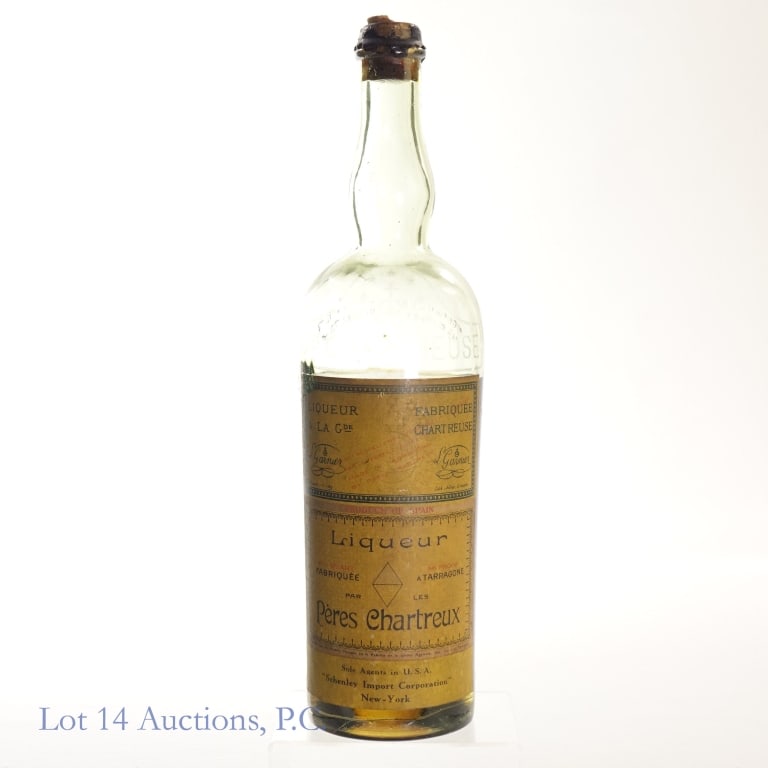 Chartreuse Yellow Une Tarragone Liqueur***UNSEALED: Chartreuse Yellow Une Tarragone Liqueur, 86 Proof, 4/5 Quart, estimated to have been bottled in the 1930s, Schenley Import.***Cork and wax broken but inner cork remains intact and is unopened. Bottle 