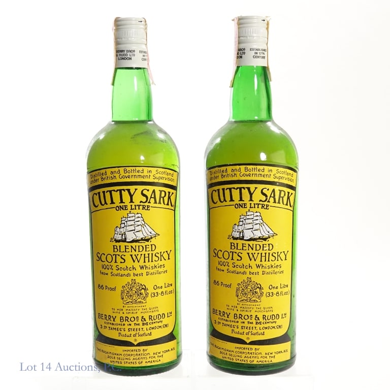 1970s/1980s Cutty Sark Blended Scots Whisky 2, 1L: 2 bottles total in this lot. Cutty Sark Blended Scots Whisky, 86 Proof, 1 Liter, late 1970s-early 1980s bottling (x2). Tax strips on both bottles torn and slightly peeling on edges but intact overall.