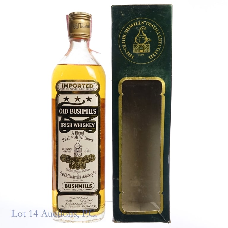 1980s Old Bushmills Blended Irish Whiskey: Old Bushmills Blended Irish Whiskey, 80 Proof, 750 ml, 1980s bottling. Tax strip torn through at one end but intact overall. Please see photos for additional details. Original box included, slightly s