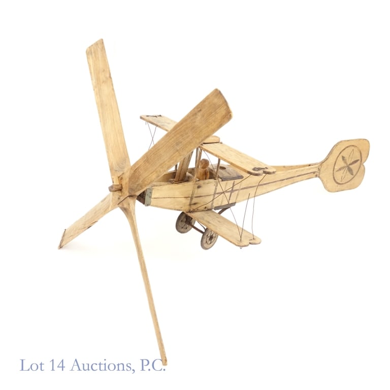 Primitive Wooden Bi-Plane Airplane (Approx 4ft. long, 3ft. Propeller): Primitive Wooden Bi-Plane. A large wooden bi-plane for display. Body / Wings 45" x 22" x 16". Propeller - 37". Propeller can be unattached for storing, shipping. Wiring connecting wings broken but not
