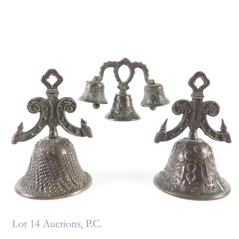 Bronze Church Bells (3): Bronze Church Bells (3). Two (2) large bells 8" x 5". One set of three (3) bells 5" x 7". One large bell exhibits a cross. Bells show wear from time, but sound beautiful. See photos for more details.