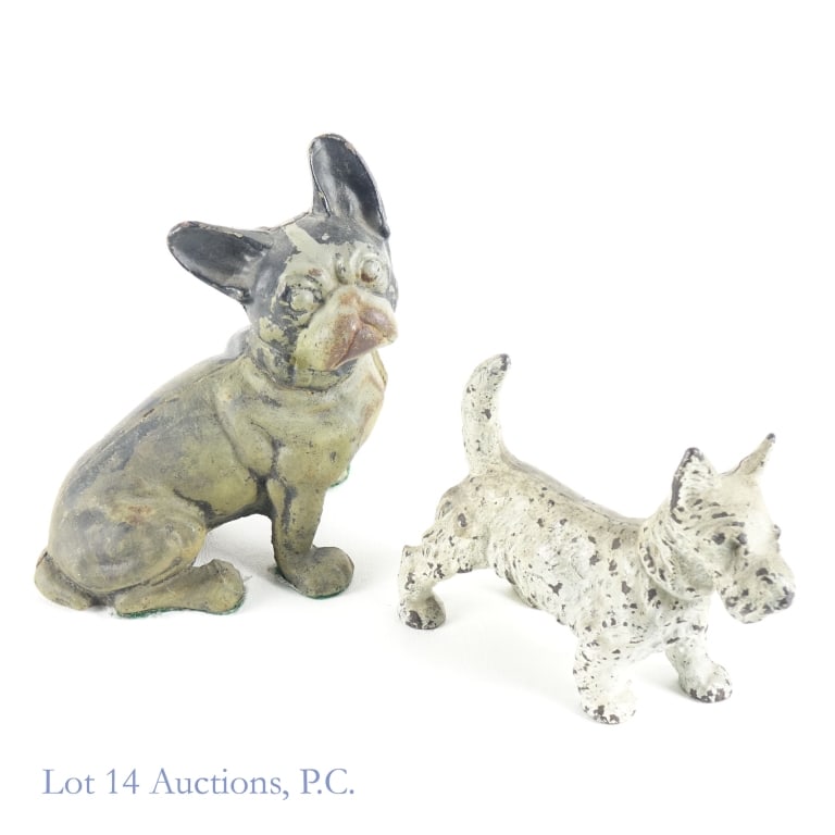 Cast Iron Dogs (2): Cast Iron Dogs (2). 6" x 8" French Bulldog doorstop with felt on feet. 6" x 5" solid Scottie Dog doorstop. Wear and tear appropriate with age and use. See photos for more details.