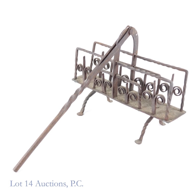 Hand Forged Toaster 18-19 c.: Hand Forged Toaster 18-19 c. 9" x 4" x 19" wrought iron toaster circa late 18th to early 19th century. Despite the age and use, handle rotates from one side to the other in order to evenly toast items