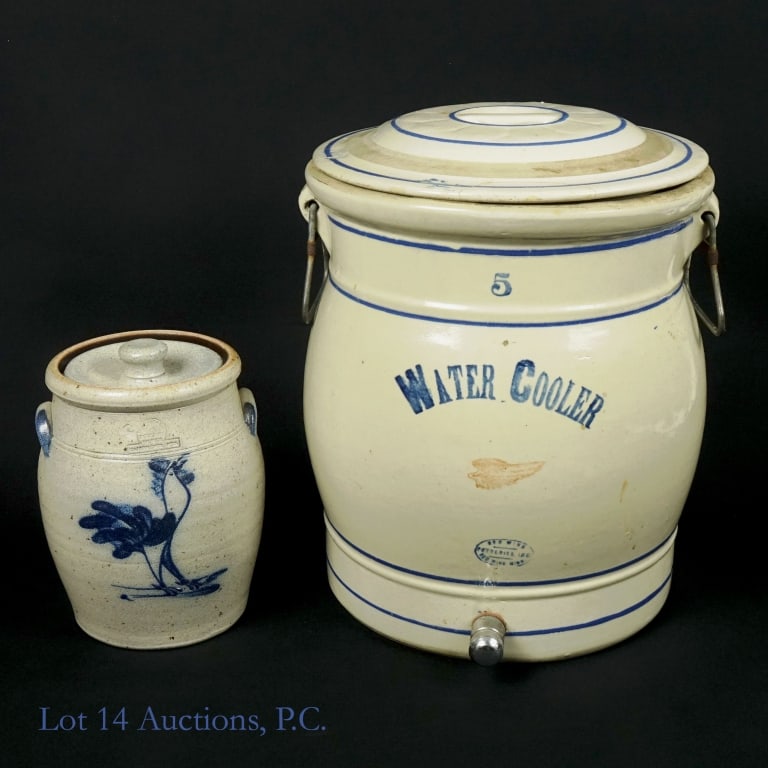 Red Wing & Blue Rowe Stoneware (2): Red Wing & Blue Rowe Stoneware (2). LOCAL PICK UP OR 3RD PARTY DELIVERY ONLY. Red Wing #5 gallon stoneware water cooler with lid (15.5" h, 13" d) --lid cracked and repaired in two spots 25 lb. Blue Ro