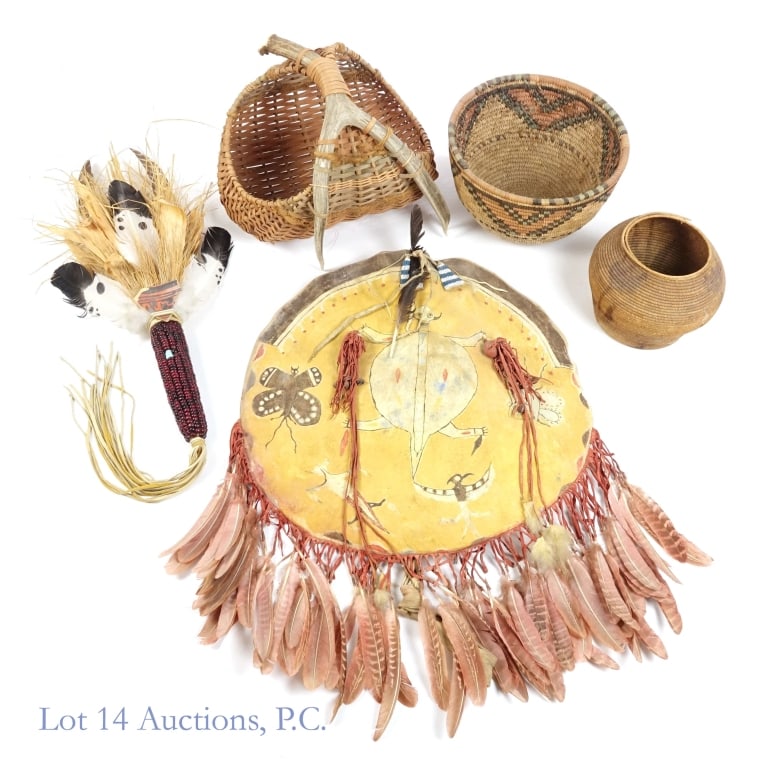 Native American Shield & Baskets: Collection of Native American pieces: Handmade animal skin shield. Approximately 20" diameter. ***** Two hand-made Native American baskets (without handles). The smaller is approximately 6" tall with 