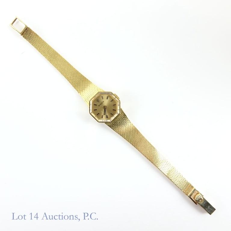 14k Y Gold Rolex Woman's Wrist Watch: Rolex woman's wrist watch. Marked "14k Gold" and tests electronically as 14 karat gold. Octagonal face and crystal. Movement No. 1400. 18 jewels. Serial number: 24715. "8402" also stamped inside case