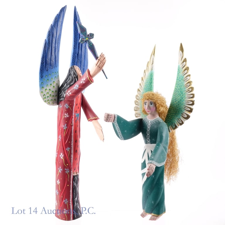 Mexican Wooden Angelic Figurines (2): 2 tall Oaxacan wooden carvings depicting unique angelic figures both raising their arms in praise with beautifully colored wings and robes. Taller figurine, holding a totem of some kind with blue and 
