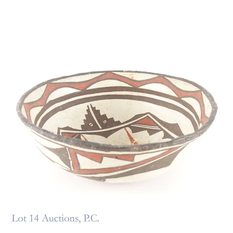 Zuni Bowl, Early 1900's: Zuni Bowl, Early 1900's. 9.75" d. x 3.5" h. bowl made by the Zuni Tribe in the first half of the 20th century. Item shows two (2) internal cracks that do not go all the way through, one (1) chip near 