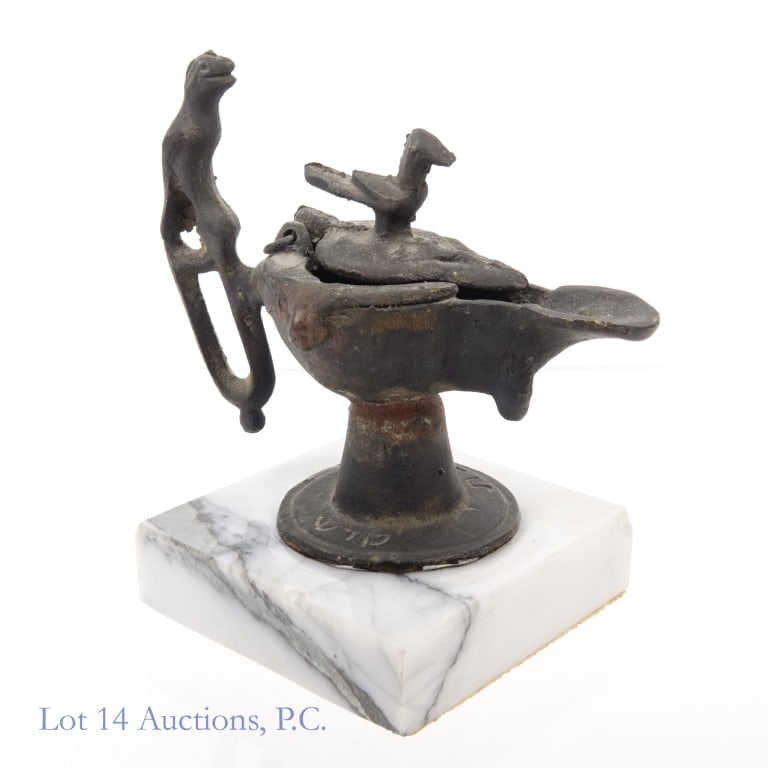 Bronze Lamp, Hebrew, Roman Empire: Bronze Lamp, Hebrew, Roman Empire. 4" x 4.5" bronze lamp with bird finial with "Shabbat" (Sabbath) and "Kadosh" (Holy) on the base in Hebrew. Item possibly Roman Empire era. Item is museum glued to 3"