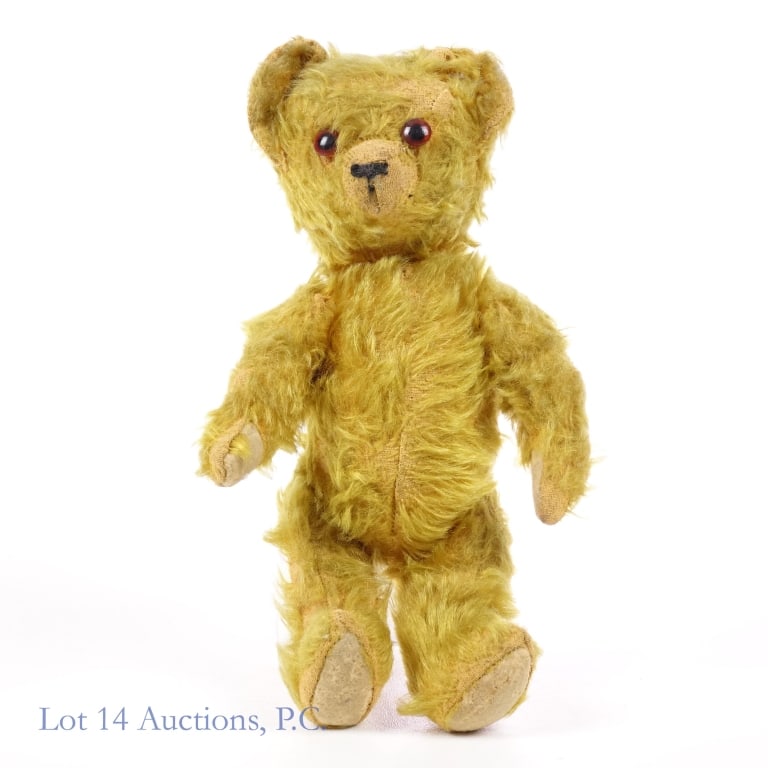 Yellow Stuffed Teddy Bear, Articulated Vintage: Yellow Stuffed Teddy Bear. Firmly stuffed, but it seems there's some patches of fur missing in certain parts. Also seems to have some sewn repairs on the back. Measures about 11" tall and 6" wide paw 