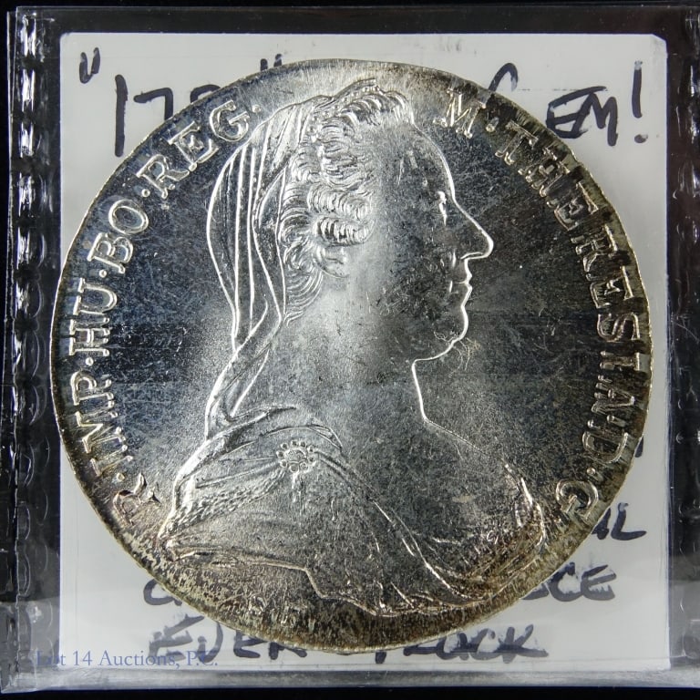 "1780" Silver Maria Theresa Thaler RESTRIKE (GEM BU): RESTRIKE - "1780" Silver Maria Theresa Thaler. Per consigner, grades GEM BU. Originally struck in Austria between 1740 and 1780, it was the circulating currency of the Holy Roman Empire and one of the