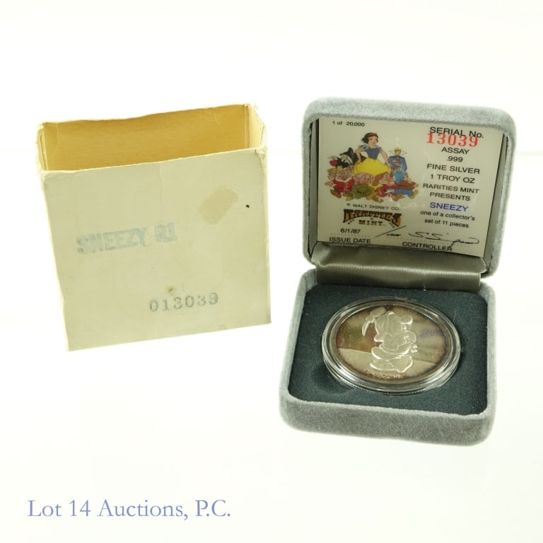 1987 Silver 1 ozt. Walt Disney Sneezy Round: 1987 silver Walt Disney "Sneezy" round (Rarities Mint) part of Snow White 50th anniversary celebration in original package with COA. Serial no. 13,039 out of 20,000 mintage. Metal is .999 fine silver 