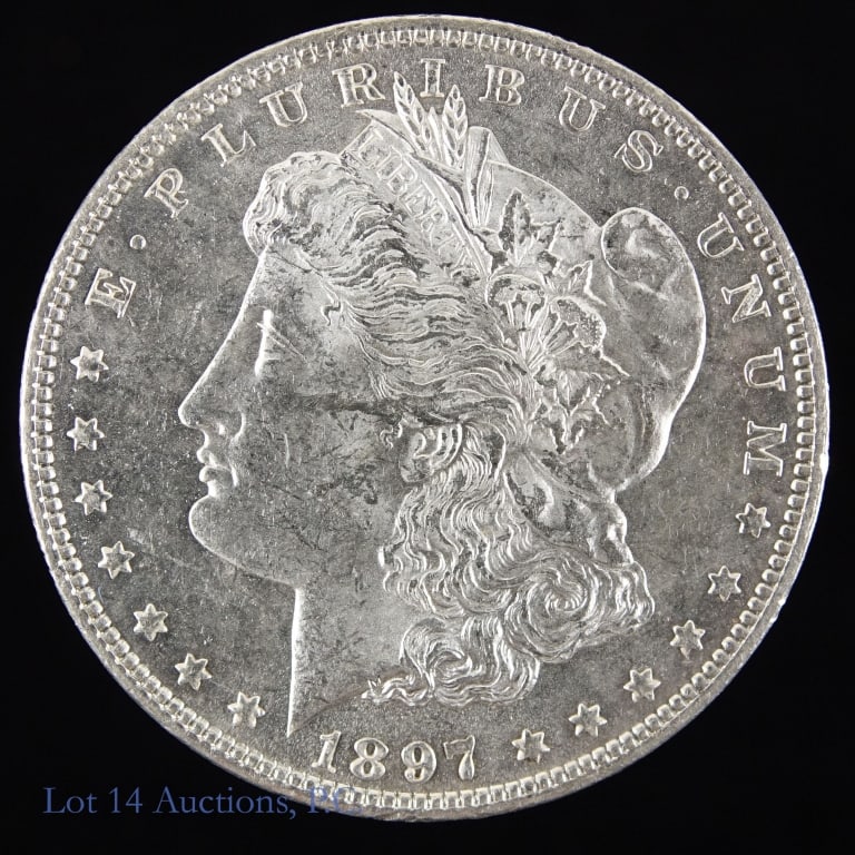 1897 (P) Silver Morgan Dollar (CH BU P/L): 1897 silver Morgan dollar (Philadelphia Mint). Series named after designer George T. Morgan. Per consigner, grades CH BU with proof like surfaces. Metal is 90% silver, weighs 26.73 grams and measures 