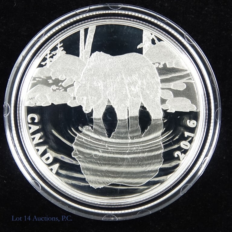RCM 2016 $10 silver grizzly bear coin in OGP: 2016 Canadian $10 silver grizzly bear coin in OGP. Comes with wood display box for three coins in series. Reverse designed by Maurade Baynton that features an engraved depiction of a grizzly bear step
