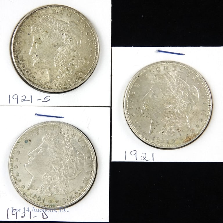 1921 P, D, S Silver Morgan Dollars (3): Three (3) silver Morgan dollars (Philadelphia, Denver, San Francisco Mints). Designer is George T. Morgan. Metal is 90% silver, weighs 26.73 grams and measures 38.1 mm each coin. Dates and mintages as