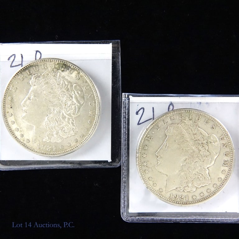 1921 (P) Silver Morgan Dollars (VF-XF) (2): Two (2) 1921 silver Morgan dollars (Philadelphia Mint). Designer is George T. Morgan. Per consigner, grades VF to XF. Metal is 90% silver, weighs 26.73 grams and measures 38.1 mm each coin. Mintage is