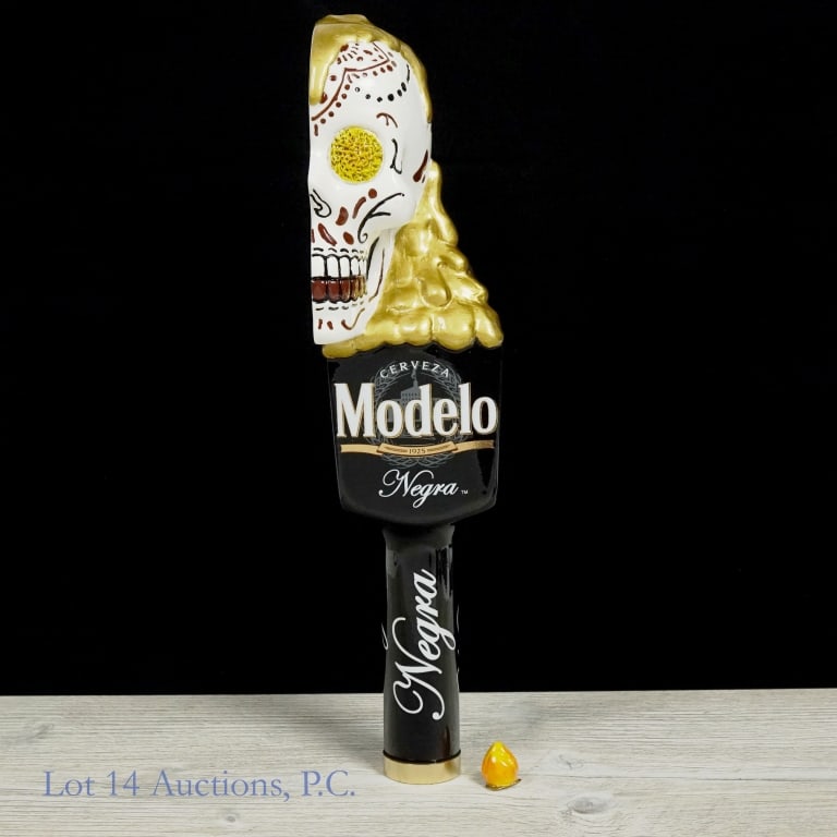 Modelo Cerveza Negra Tap Handle: Modelo Cerveza Negra Tap Handle, c. 2018, with half "calavera" skull motif for handle and traditional Modelo Negra stem in black. Some wear to handle, scuff on side of the skull and fire piece on top