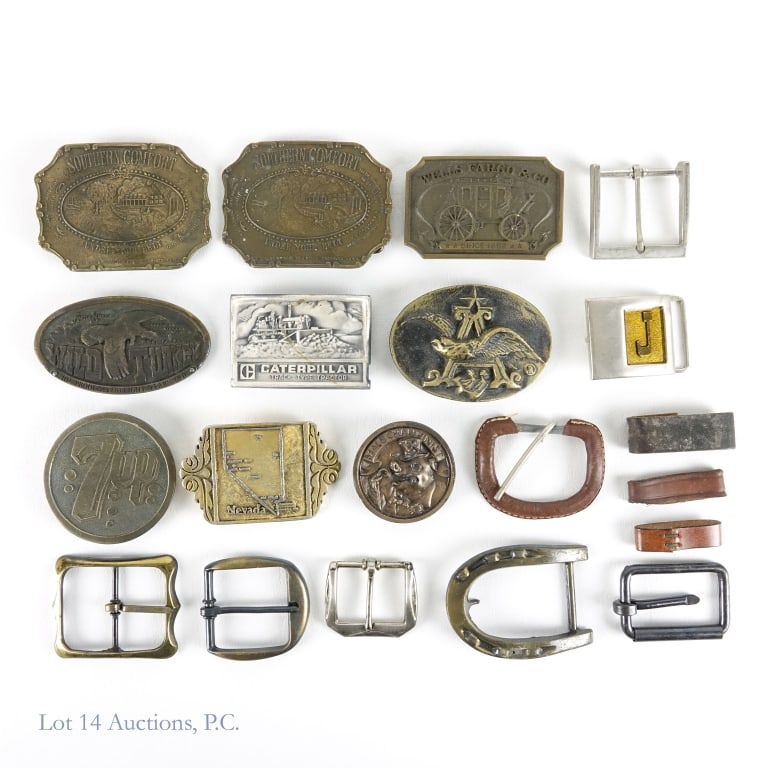 Wild Turkey, Southern Comfort & More Belt Buckles: Box of over 10 assorted metal belt buckles including several major brands such as: Southern Comfort, Wild Turkey and 7 Up. Other brands include Wells Fargo and Caterpillar Track Type Factor. Several o
