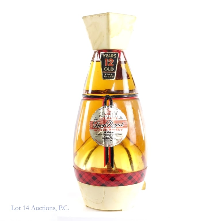 Spey Royal 12 Year Scotch Music Box Decanter: Gilbey's Spey Royal 12 Year "The Dancing Scot" Music Box Blended Scotch Decanter, 86 Proof, 4/5 Quart, early 1960s-late 1970s. Music box plays "Auld Lang Syne" song, music box has been tested and is i