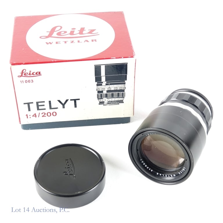 Leica Leitz 11063 Telyt 1:4, 200mm Lens: Leica Leitz 11063 Telyt 1:4, 200mm Lens. Leica Leitz Wetzlar 11063 Telyt lens with built in sunshade in original box. Serial #2176531. Well maintained with light wear on barrel. Minor scuffs and dings