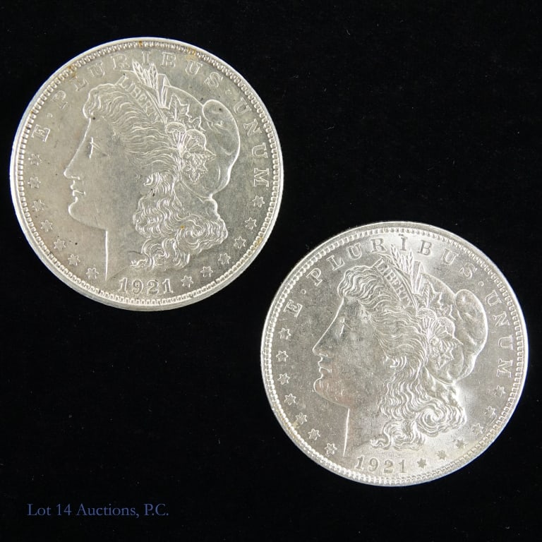 1921 (P) USA 90%-Silver Morgan Dollars (AU-BU) (2): Two (2) 1921 silver Morgan dollars (Philadelphia Mint). Designer is George T. Morgan. Per consigner, grades AU to BU. Metal is 90% silver, weighs 26.73 grams each coin and measures 38.1 mm in diameter