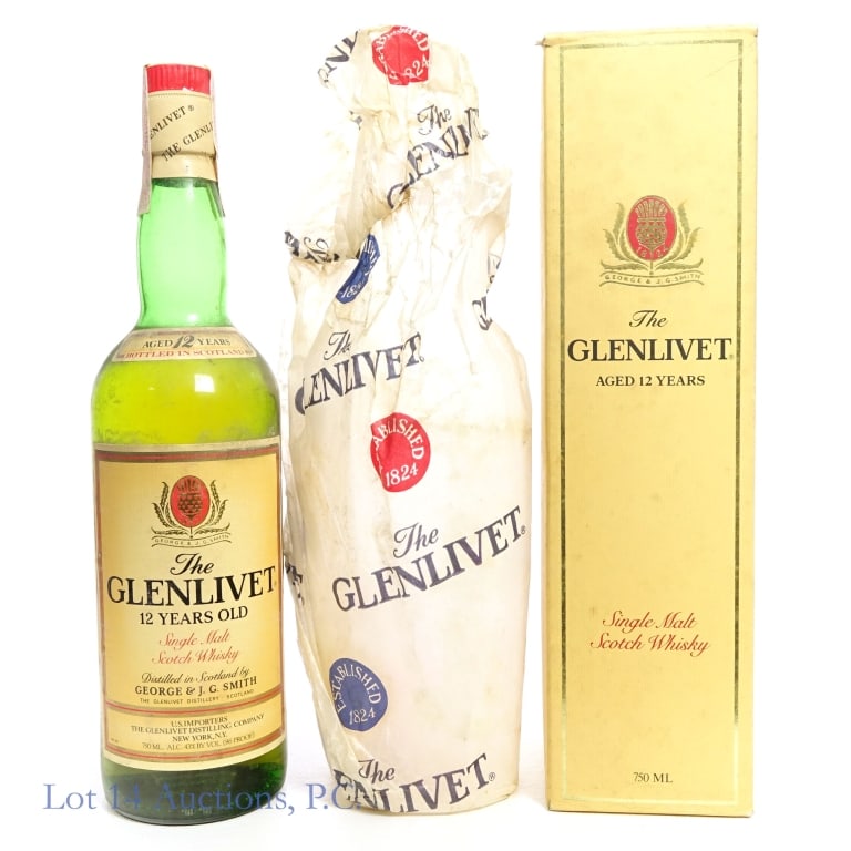 1980s Glenlivet 12 Year Single Malt Scotch: Glenlivet 12 Year Single Malt Scotch, 86 Proof, 750 ml, estimated to be 1980s bottling. Some tearing to tax strip but in fair condition otherwise. Residue on bottle. Original box included, also slight