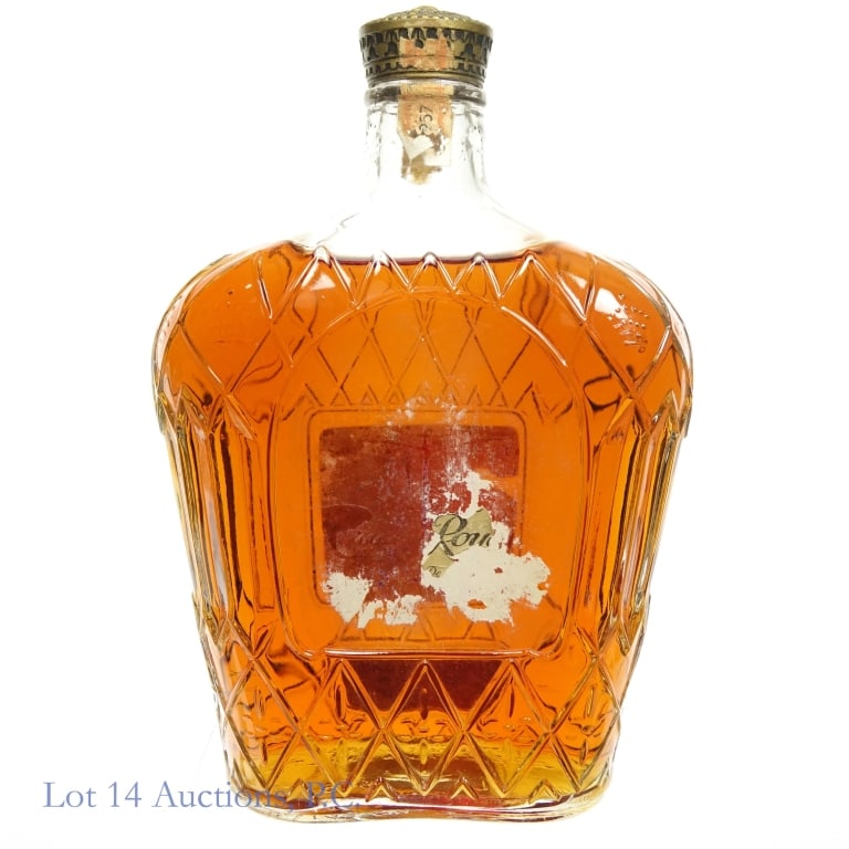 1957 Crown Royal De Luxe Canadian Whisky (1 Qt)*: Crown Royal Fine De Luxe Canadian Whisky, 80 Proof, Distilled: 1 Quart, Distilled: 1957***Tax strips almost completely disintegrated but remains intact over back seal indicating that bottle likely has