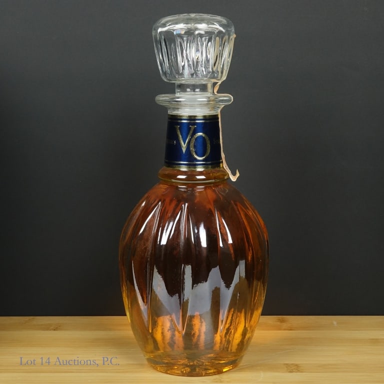 1977 Seagram's 6 Year VO Canadian Whisky Decanter: 1977 Seagram's 6 Year VO Canadian Whisky Decanter, 80 Proof, 750 ml, Distilled: 1977, Tax strip slightly stained and peeling with some tears but overall in fair condition. Please see photos for additi