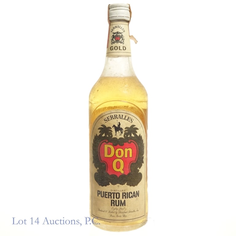 1970s Don Q Puerto Rican Rum: Don Q Puerto Rican Rum, 80 Proof, 4/5 Quart, early 1960s-late 1970s tax strip "74" glass molding. Tax strip worn and slightly peeling at edges but intact overall. Severe residue on bottle congruent wi
