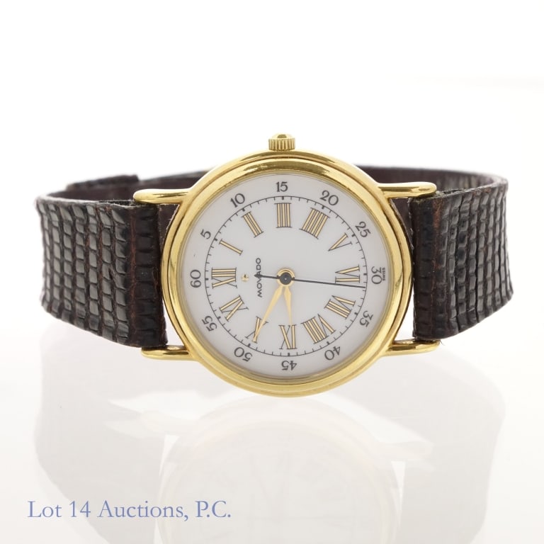 Movado Ladies Watch (87-47-825): Movado ladies wrist watch. Model 87-47-825. Roman numerals. Worn leather strap with some wear on back of case.