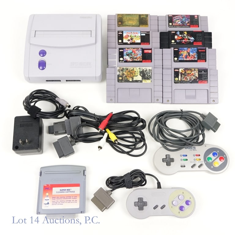 Super Nintendo ES Control Deck + 8 Games: Super Nintendo Entertainment System (NES) control deck (model SNS-101). Per consigner, tested and working. Includes power adapter, patch cords, cleaning cartridge, two controllers (1 Nintendo, 1 Doc's