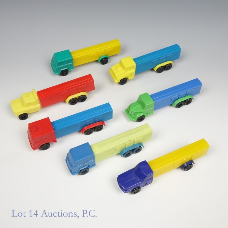 PEZ Dispensers, Trucks, 3.9-4.9 (7): PEZ, Trucks, 3.9-4.9 (7). Lot of PEZ dispensers shaped like Semi-Trucks. Most are 3.942.683, Made in Austria, No feet with spinning wheels. Exceptions are: one Made in Slovenia, with non spinning whee
