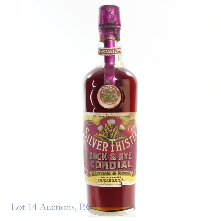 Silver Thistle Rock & Rye Cordial: Silver Thistle Rock & Rye Cordial, %ABV:N/A, 1 Pint, 6 Ounces, Tear on bottom front label, back label very worn and disintegrated. Please see photos for additional details.***This bottle is a collecti