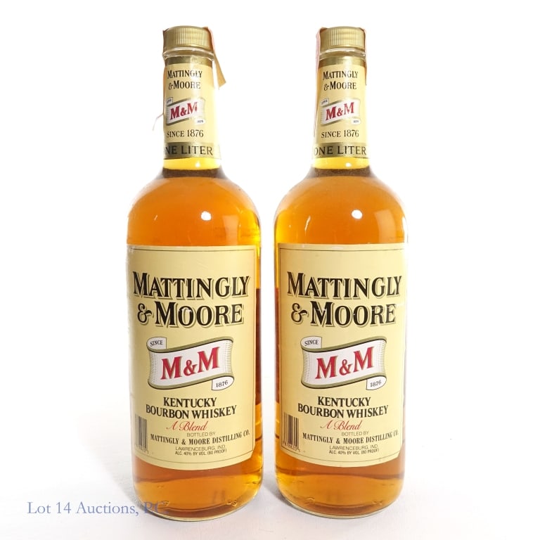 1980s Mattingly & Moore Bourbon (2, 1 Liter): 2 bottles total in this lot. Mattingly & Moore Blended Bourbon, 80 Proof, 1 Liter, "88" glass molding (x2). Paper seals in fair condition, slight peeling to strip on one bottle, but both are intact ov